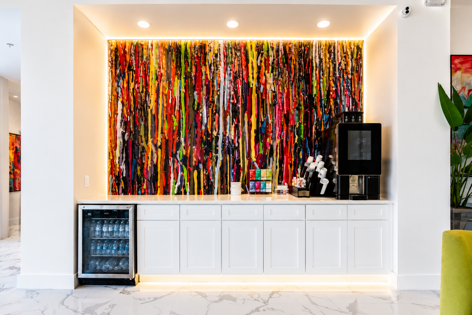 Modern Storage® Hot Springs coffee bar with white cabinets, LED lighting, beverage fridge, and colorful wall art